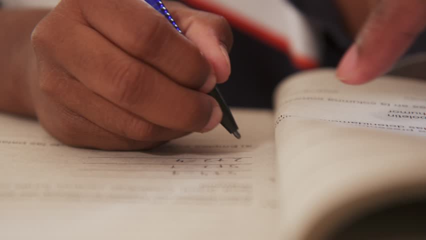 Writer writing to complete their book